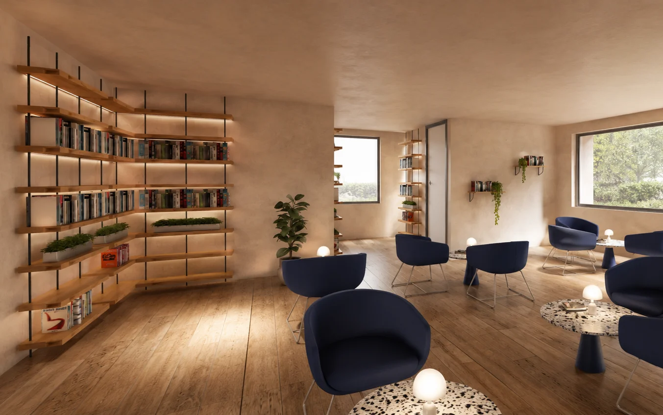 Lounge and library with lit timber shelving and navy blue armchairs